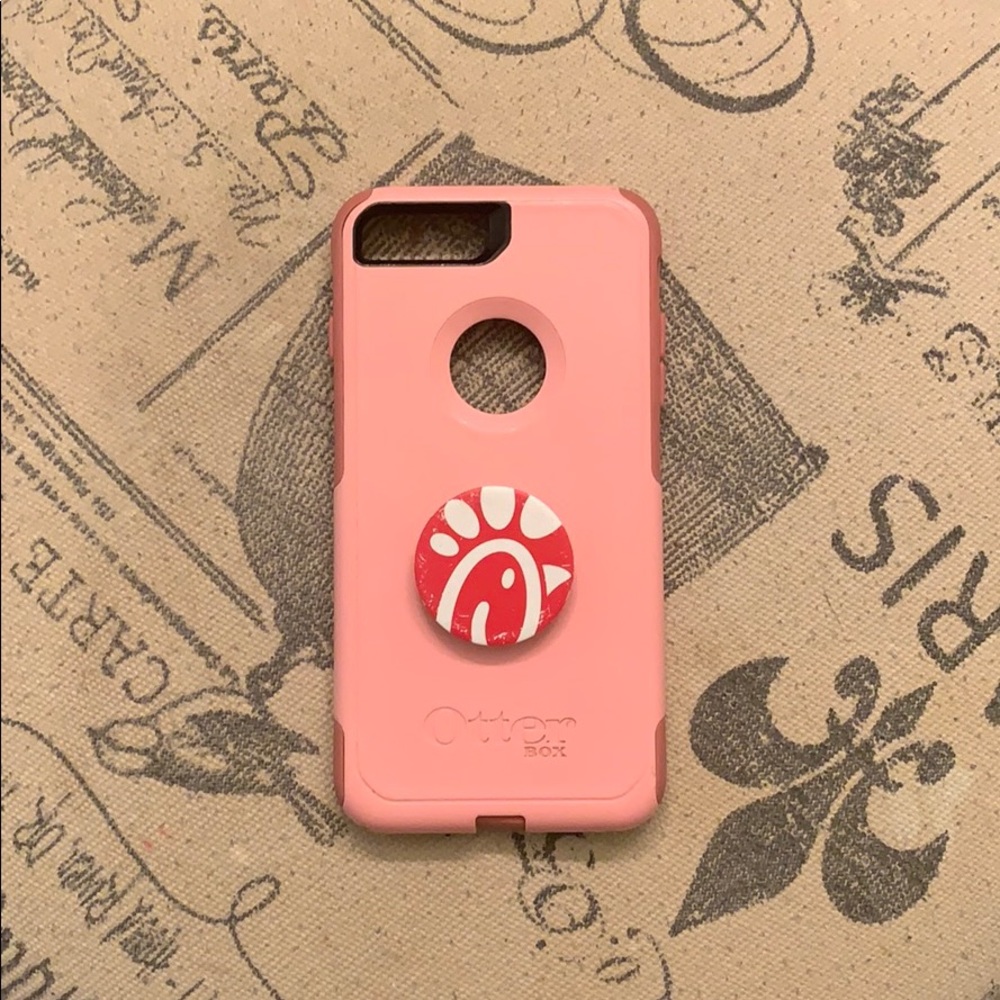 Pink Otter Box with pop socket. Has a few cracks.